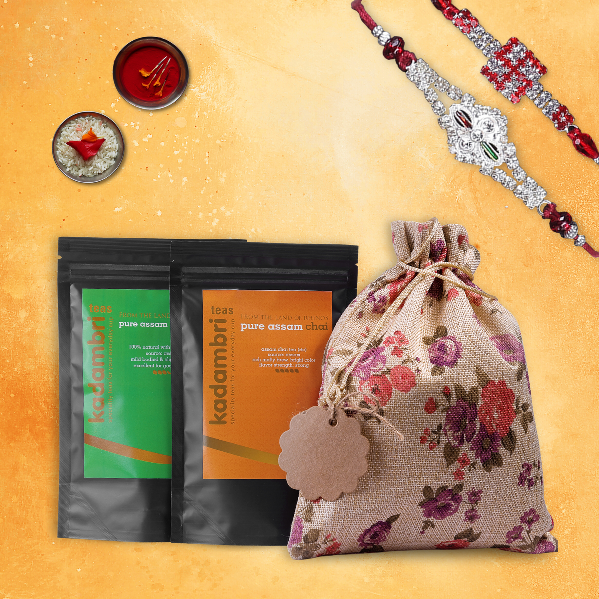Rakhi Hamper for Brother and Bhabhi with two rakhis, green tea, Assam chai and roli chawal in a jute potli bag