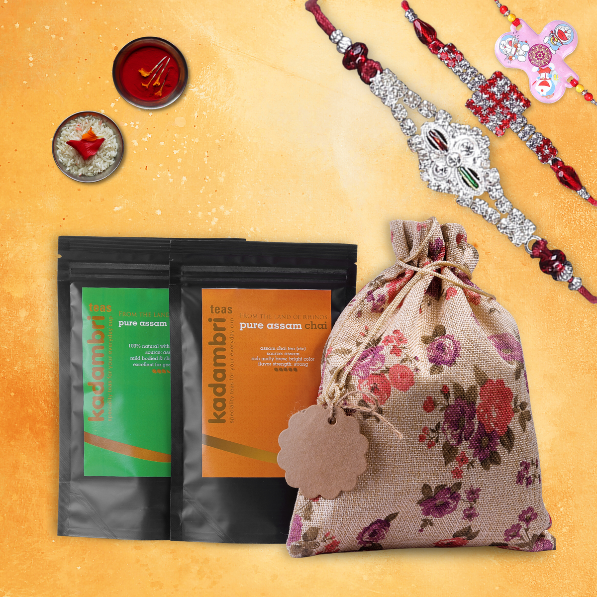 Rakhi Hamper for Brother, Bhabhi and 1 Kid with three rakhis, green tea, Assam chai and roli chawal in a jute potli bag